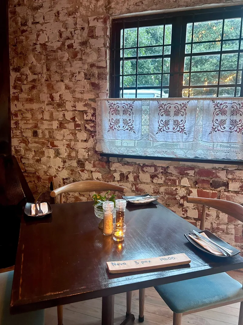 A candlelit table by the window at Nostos