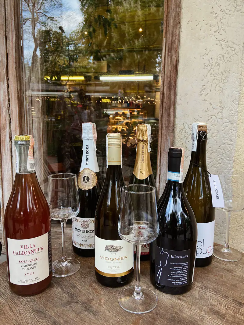 Bottles of Greek wine on a taverna shelf