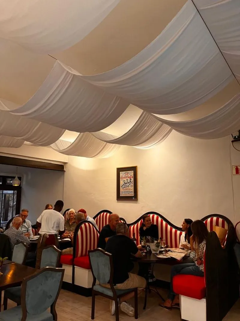 The dining room under white draped fabric
