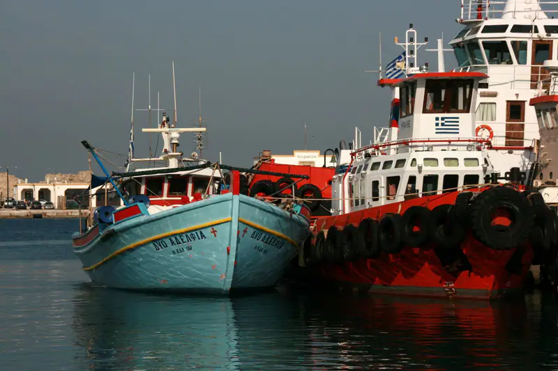 Old fishing boats moored in a Cretan harbour