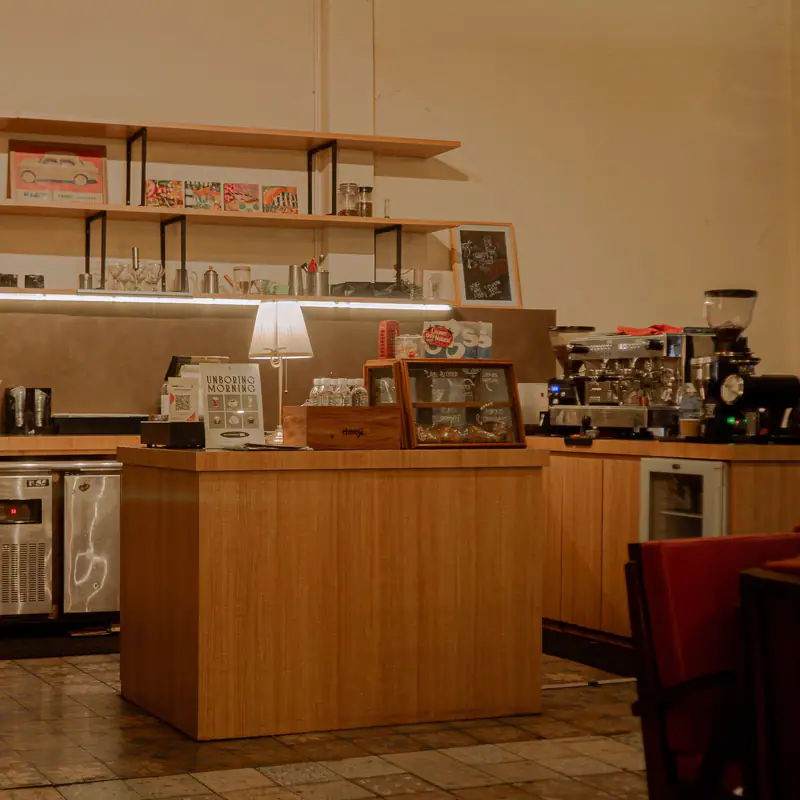 A small corner café counter with stools